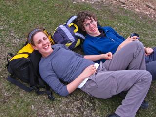 Sarah and Rob, reclining on packs