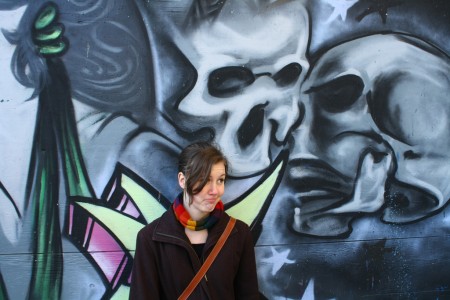 Emily Horn, looking sad with some skulls