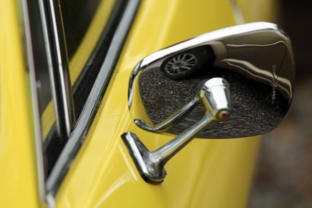 Yellow Fiat rearview mirror