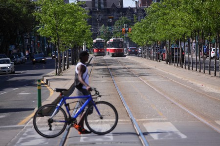 Cyclist and two streetcars