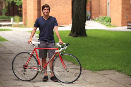 Adam Mosa with red bicycle