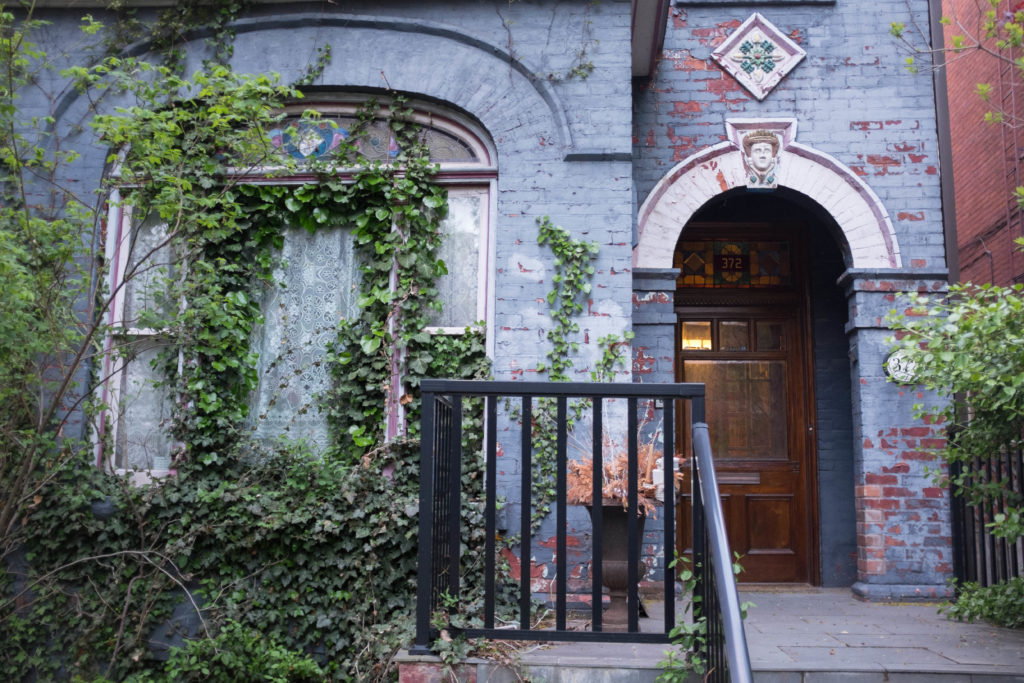 Brick house painted blue a sibilant intake of breath