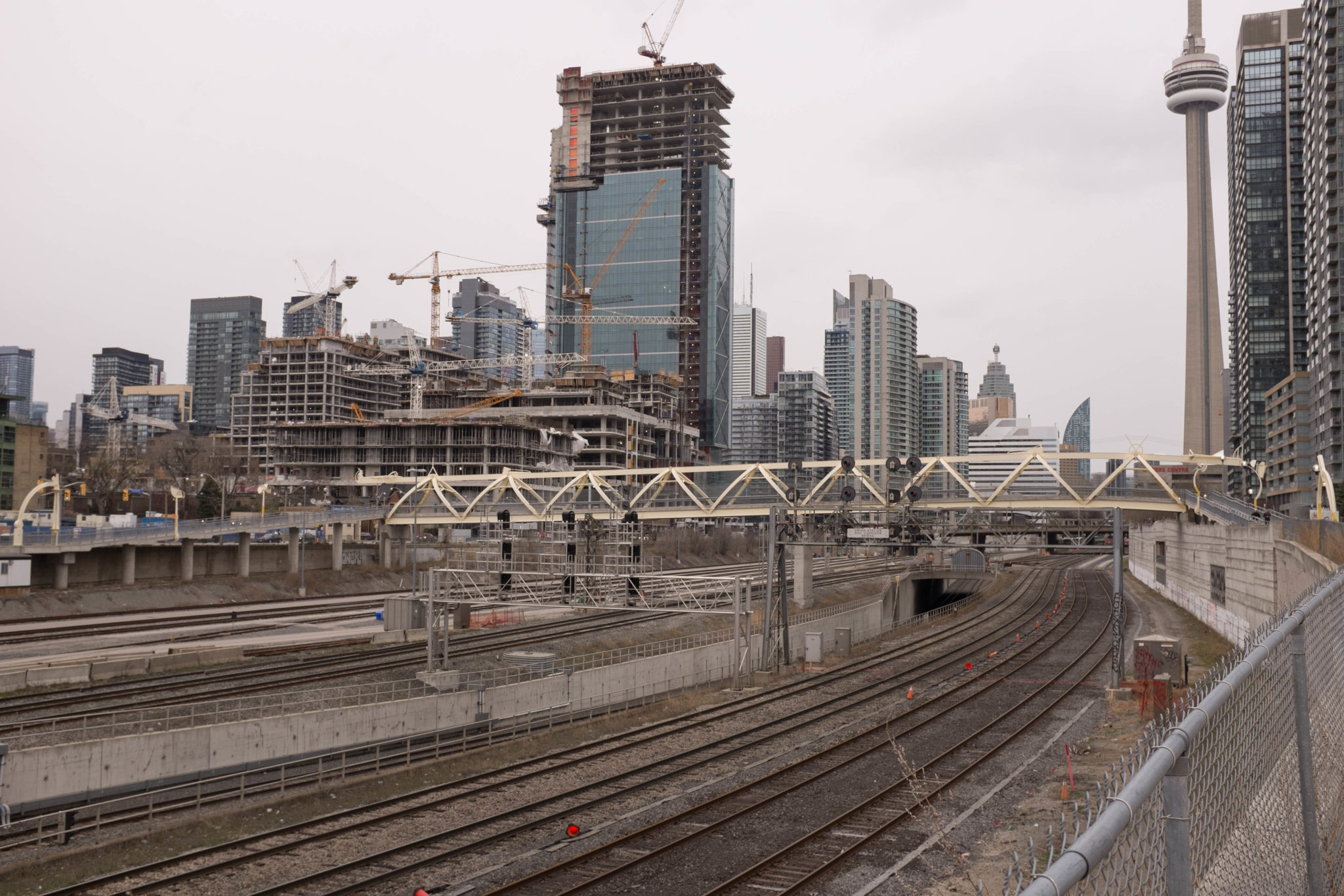 Train tracks in central Toronto a sibilant intake of breath